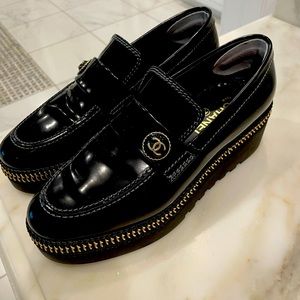 Chanel zip platform loafers in black in 39.5. Chanel button detail on top/side.